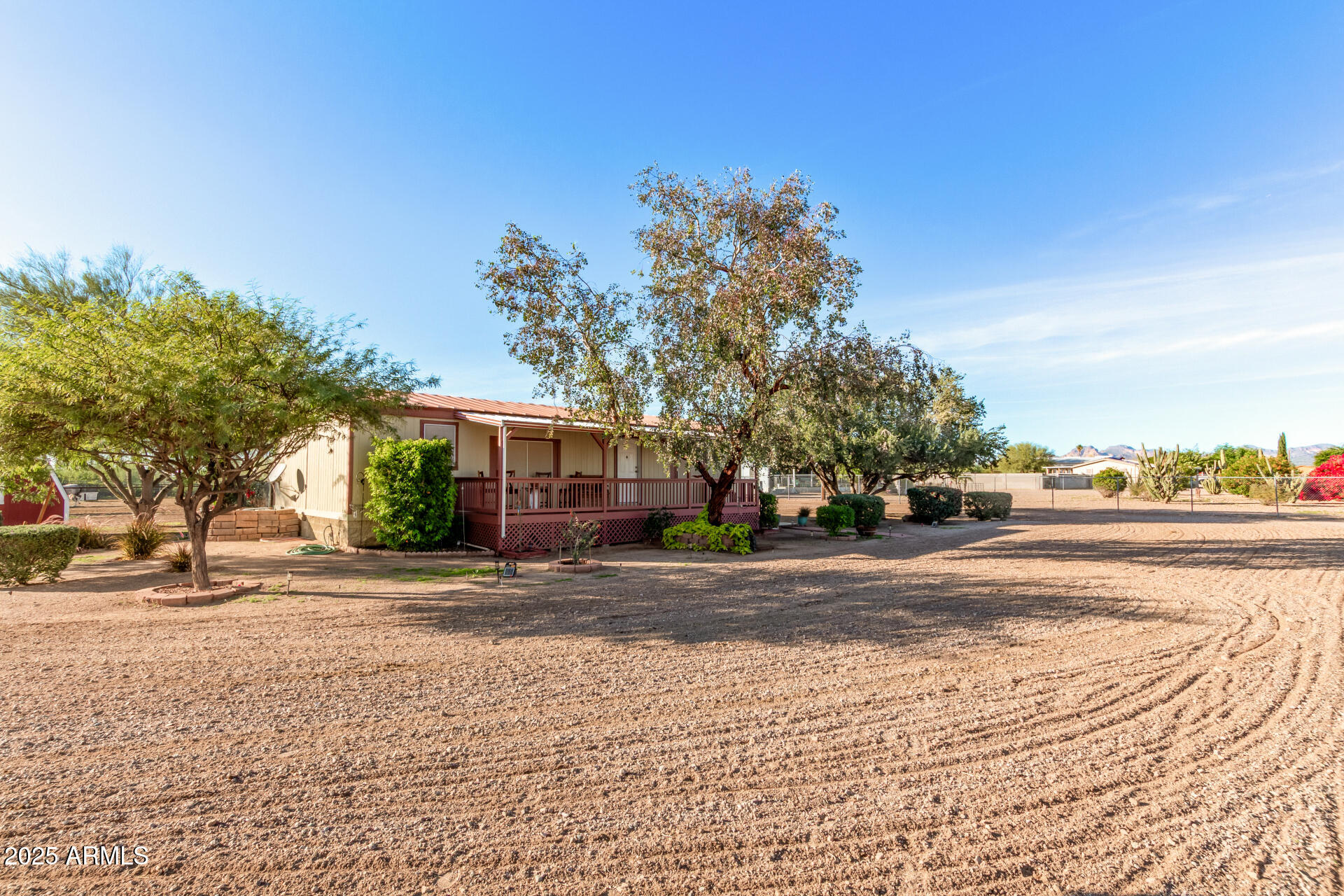 164 North Wickiup Road Apache Junction, AZ 85119 - Photo 6 of 62 a view of a house with a yard