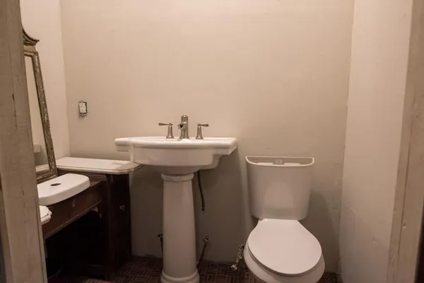 a view of a field with a tree