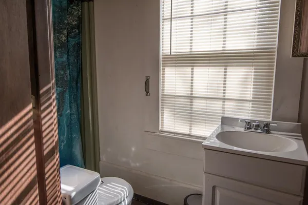 a view of a house with swimming pool and a yard