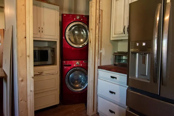 a view of a kitchen with washer and dryer