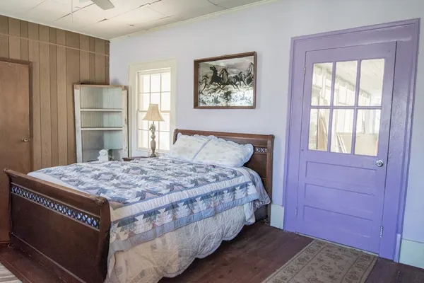 a bedroom with a bed and a dresser