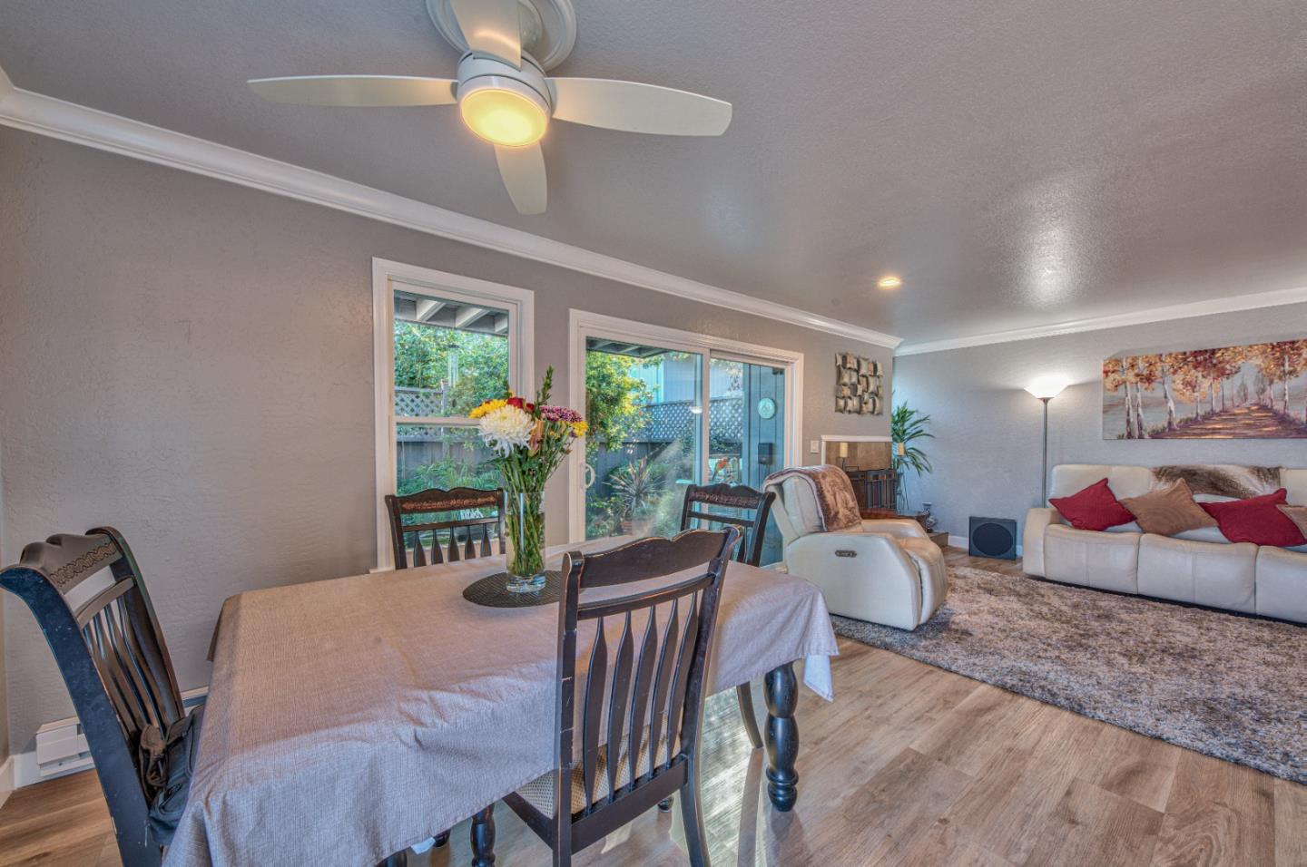 2224 Almaden Road, Unit A San Jose, CA 95125 - Photo 6 of 29 a view of a dining room with furniture a chandelier and large windows