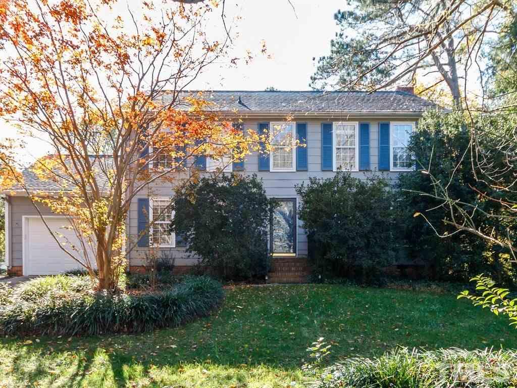 5704 Setter Circle Raleigh, NC 27609 - Photo 1 of 25 a front view of a house with a garden