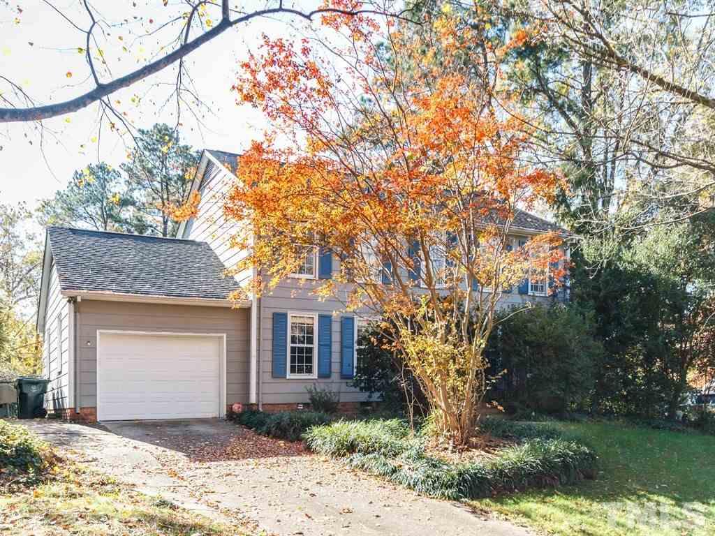 5704 Setter Circle Raleigh, NC 27609 - Photo 2 of 25 a front view of a house with a yard and garage