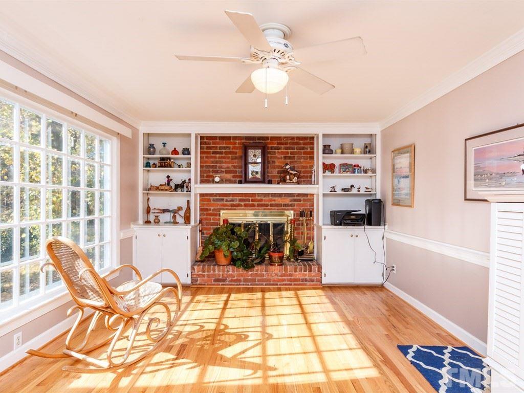 5704 Setter Circle Raleigh, NC 27609 - Photo 12 of 25 a living room with furniture a rug and a fireplace