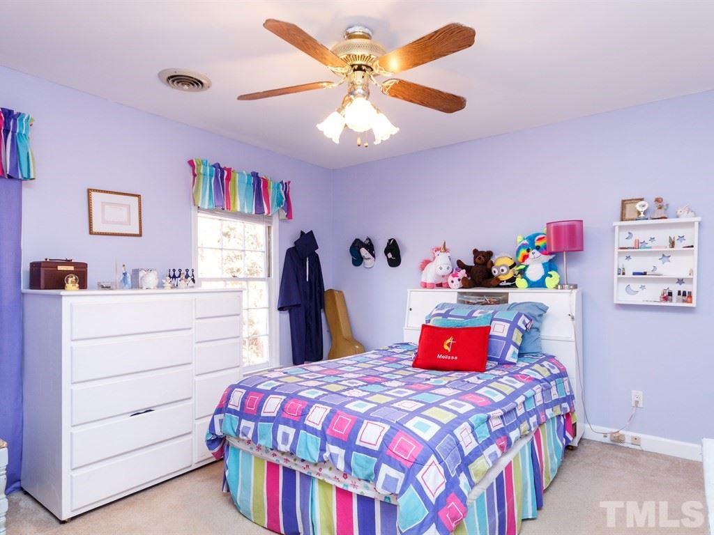 5704 Setter Circle Raleigh, NC 27609 - Photo 15 of 25 a bedroom with a bed and a closet