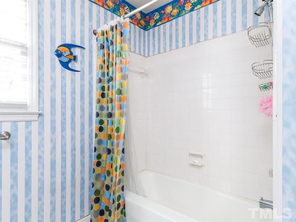 5704 Setter Circle Raleigh, NC 27609 - Photo 17 of 25 a bathroom with a sink and a bathtub