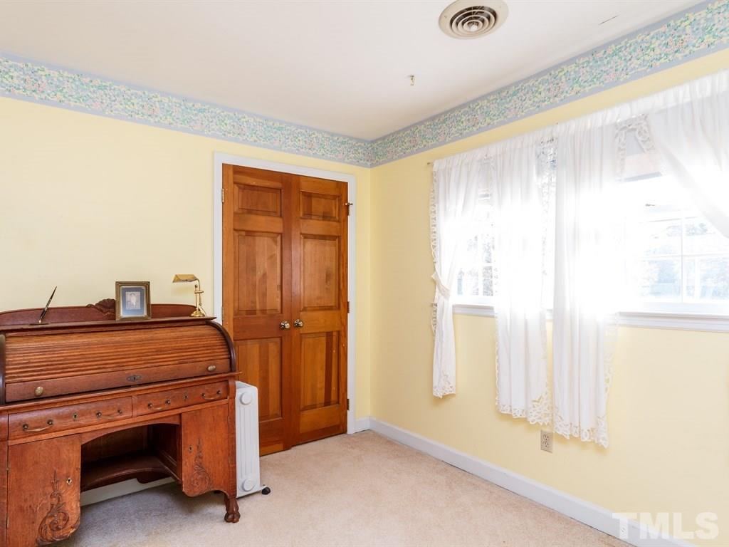 5704 Setter Circle Raleigh, NC 27609 - Photo 19 of 25 a room with a bed and a window