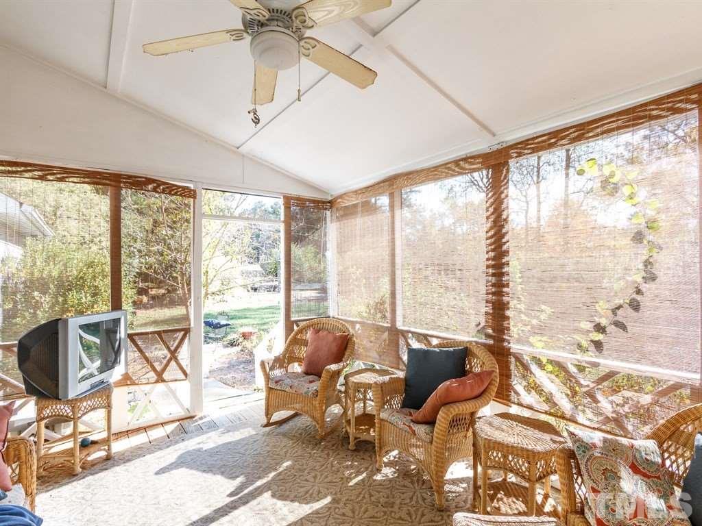 5704 Setter Circle Raleigh, NC 27609 - Photo 23 of 25 a living room with furniture and floor to ceiling windows