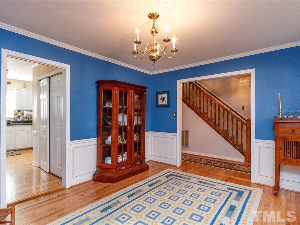 5704 Setter Circle Raleigh, NC 27609 - Photo 7 of 25 a view of a hallway with wooden floor and staircase
