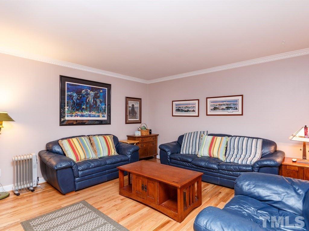5704 Setter Circle Raleigh, NC 27609 - Photo 8 of 25 a living room with furniture and a wooden floor