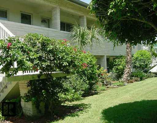 109 16th Avenue, Unit 2 Indian Rocks Beach, FL 33785 - Photo 1 of 1 a view of a house with a yard
