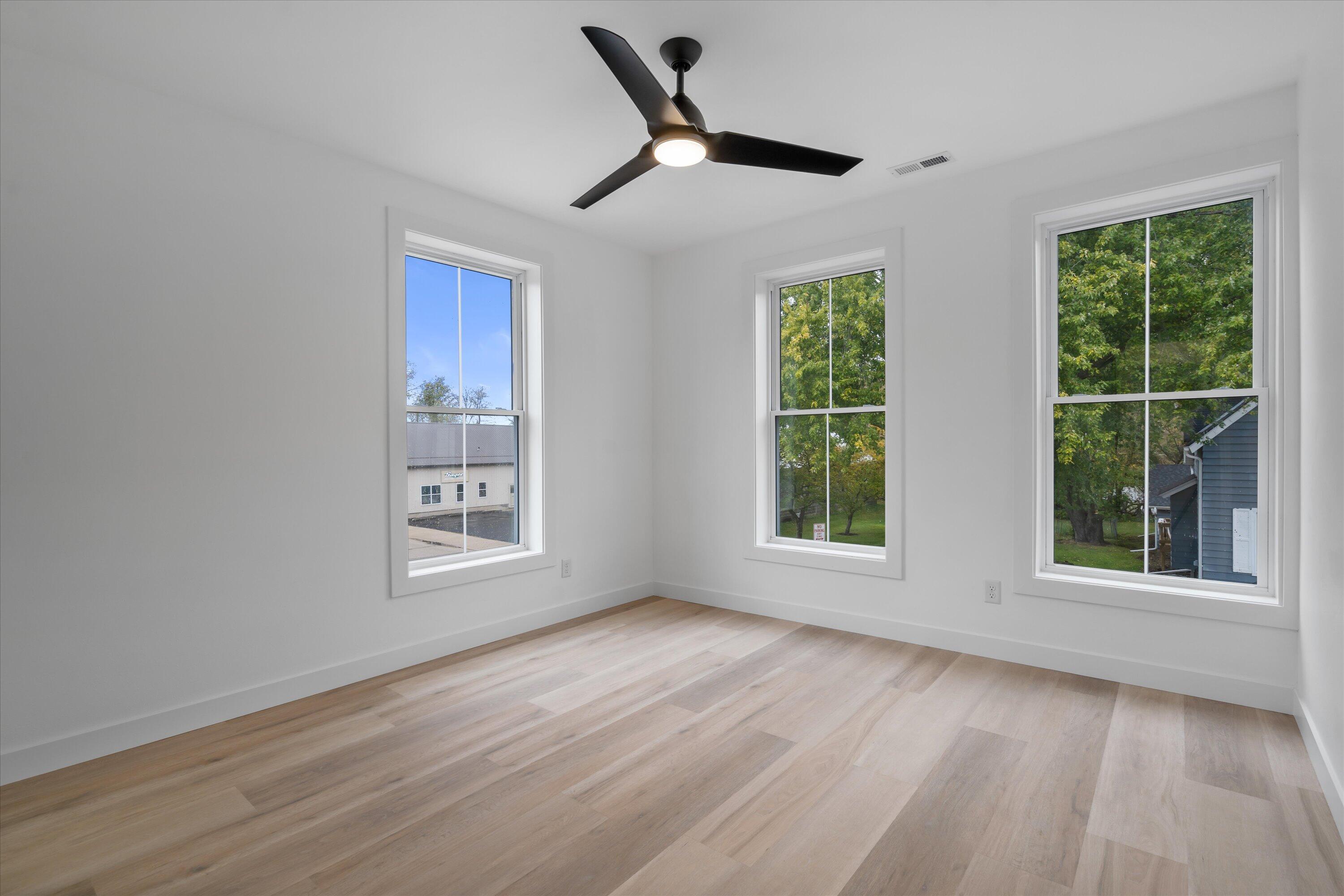 308 Oak Street, Unit 201 Slinger, WI 53086 - Photo 14 of 20 Primary Bedroom