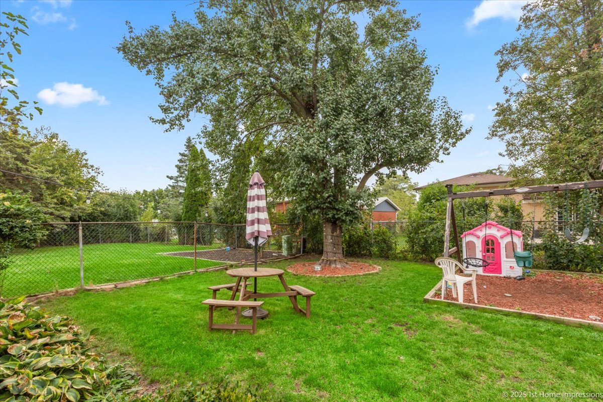 15309 Walnut Road Oak Forest, IL 60452 - Photo 20 of 23 a view of a park with a slide