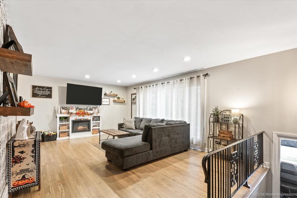15309 Walnut Road Oak Forest, IL 60452 - Photo 2 of 23 a living room with furniture and a flat screen tv