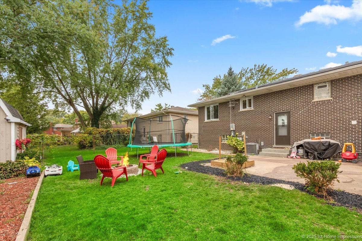 15309 Walnut Road Oak Forest, IL 60452 - Photo 21 of 23 a front view of a house with garden and sitting area