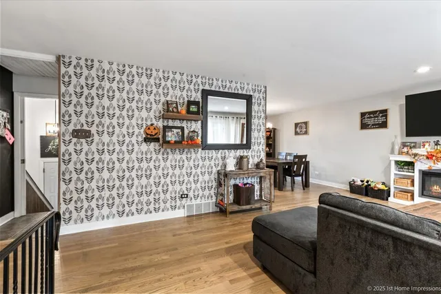 a living room with furniture and a flat screen tv