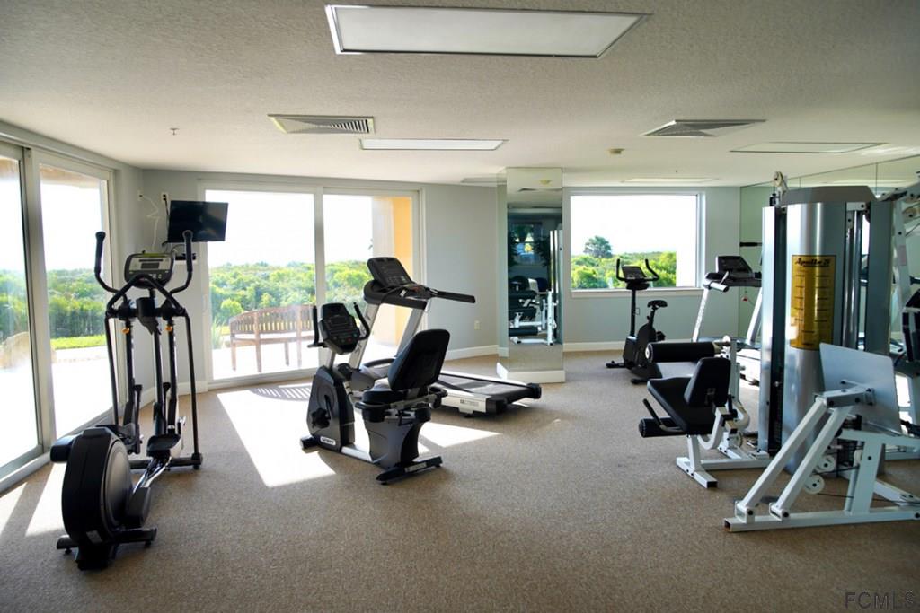 80 Surfview Drive, Unit 602 Palm Coast, FL 32137 - Photo 19 of 24 a view of a room with gym equipment
