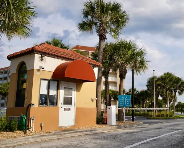an aerial view of a house with swimming pool garden and patio