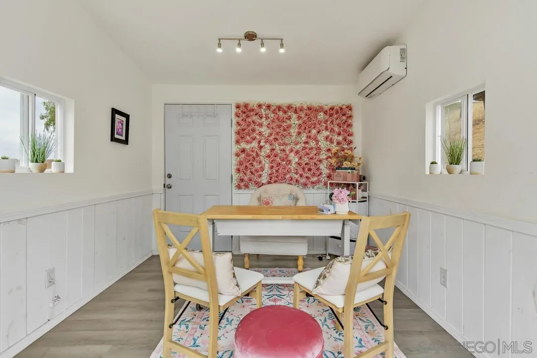 9410 Brian Way El Cajon, CA 92021 - Photo 18 of 49 a view of a dining room with furniture and wooden floor