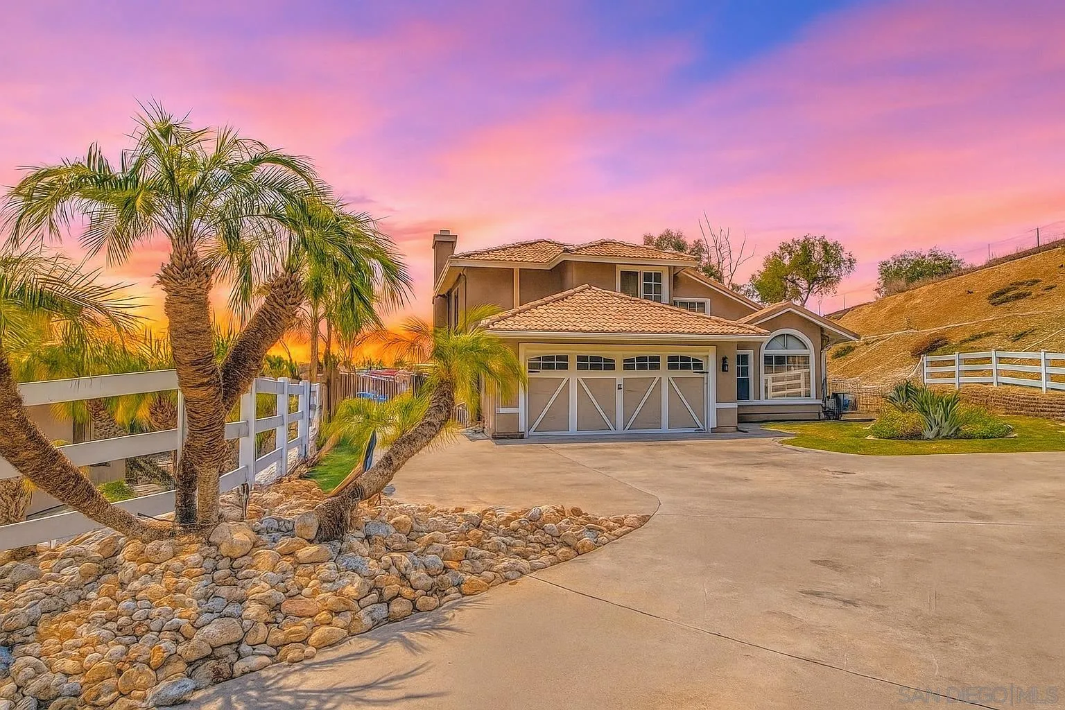 9410 Brian Way El Cajon, CA 92021 - Photo 3 of 49 a front view of a house with a yard