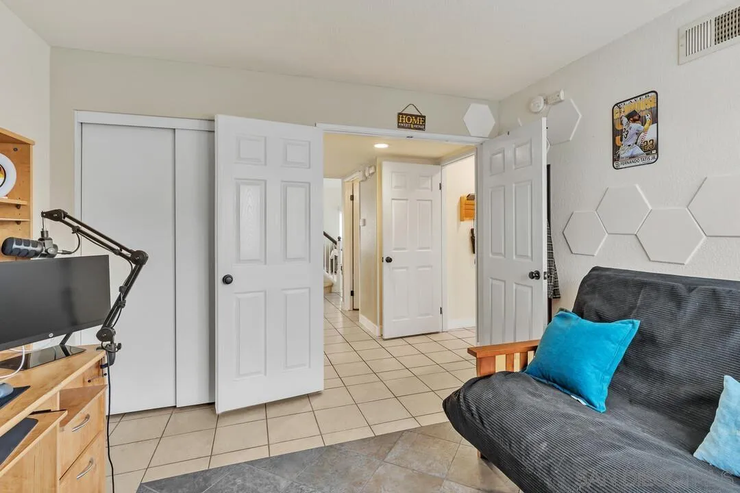 9410 Brian Way El Cajon, CA 92021 - Photo 32 of 49 a living room with furniture and a flat screen tv