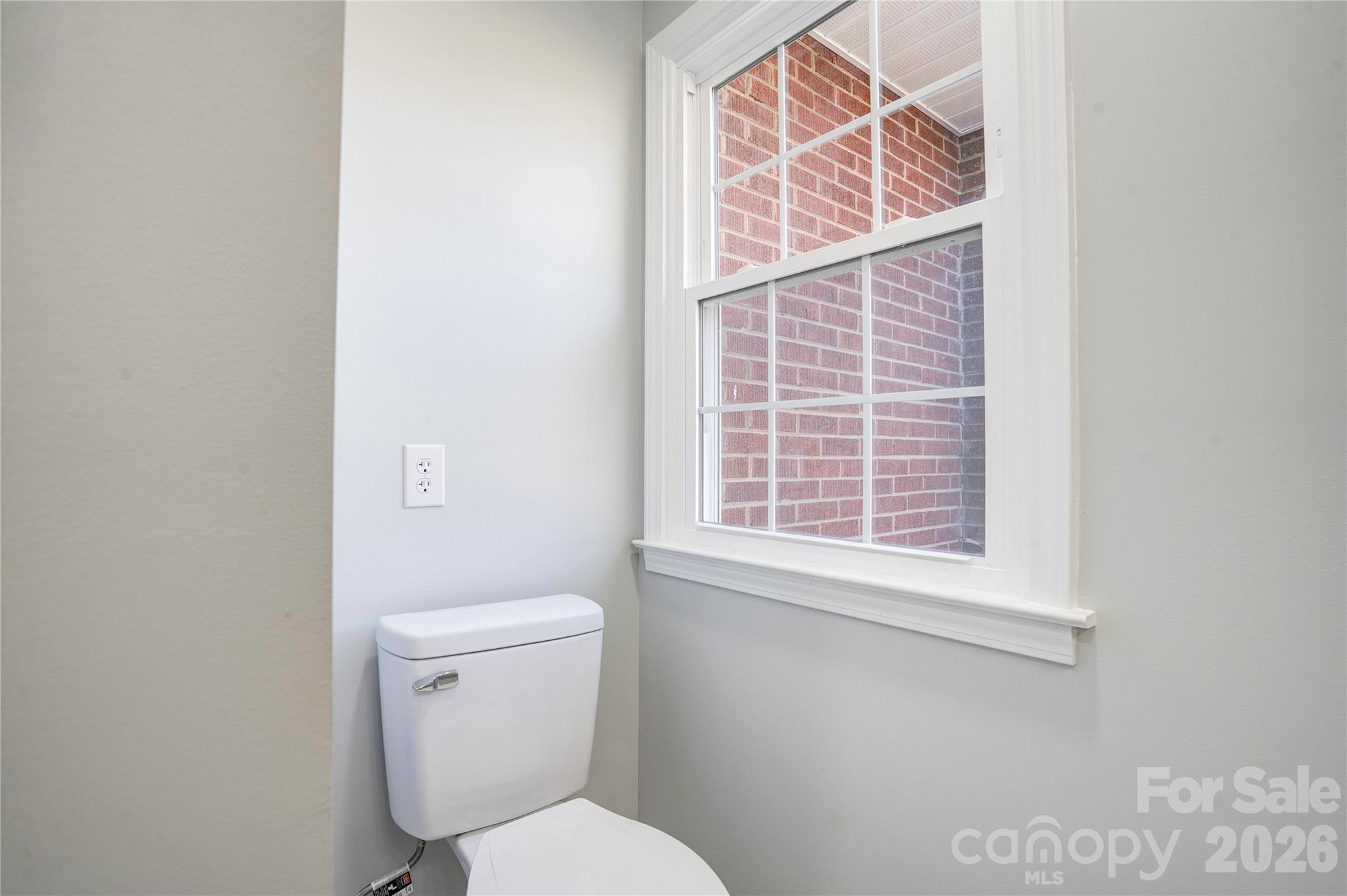 2822 Bettis Road Grover, NC 28073 - Photo 21 of 32 a white toilet sitting next to a window