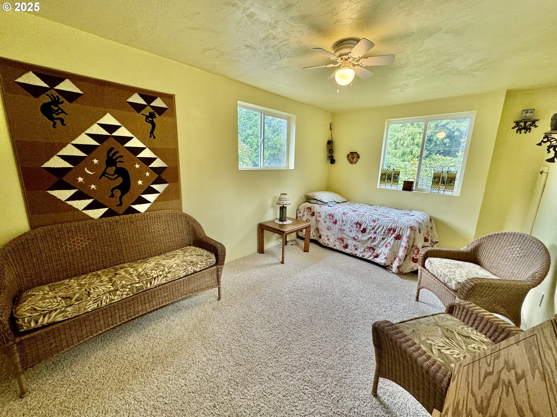 4990 Mitchell Loop Road Florence, OR 97439 - Photo 33 of 37 a bedroom with furniture and a window