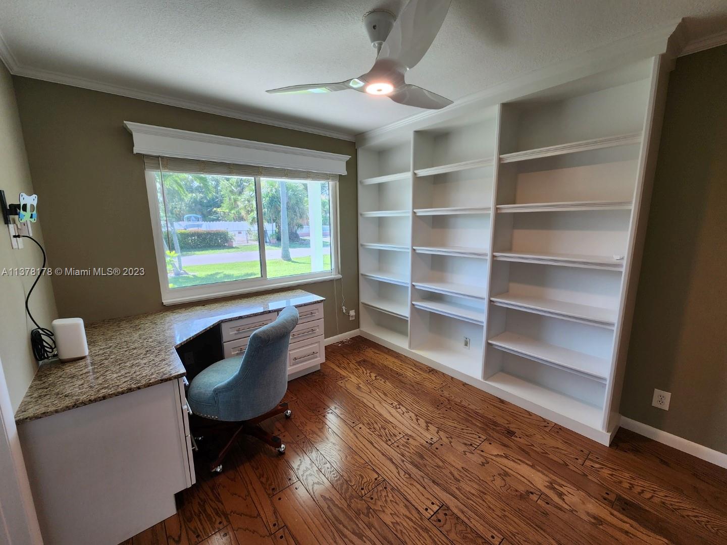 1513 Lance Road Jupiter, FL 33469 - Photo 20 of 33 a workspace with furniture window and wooden floor