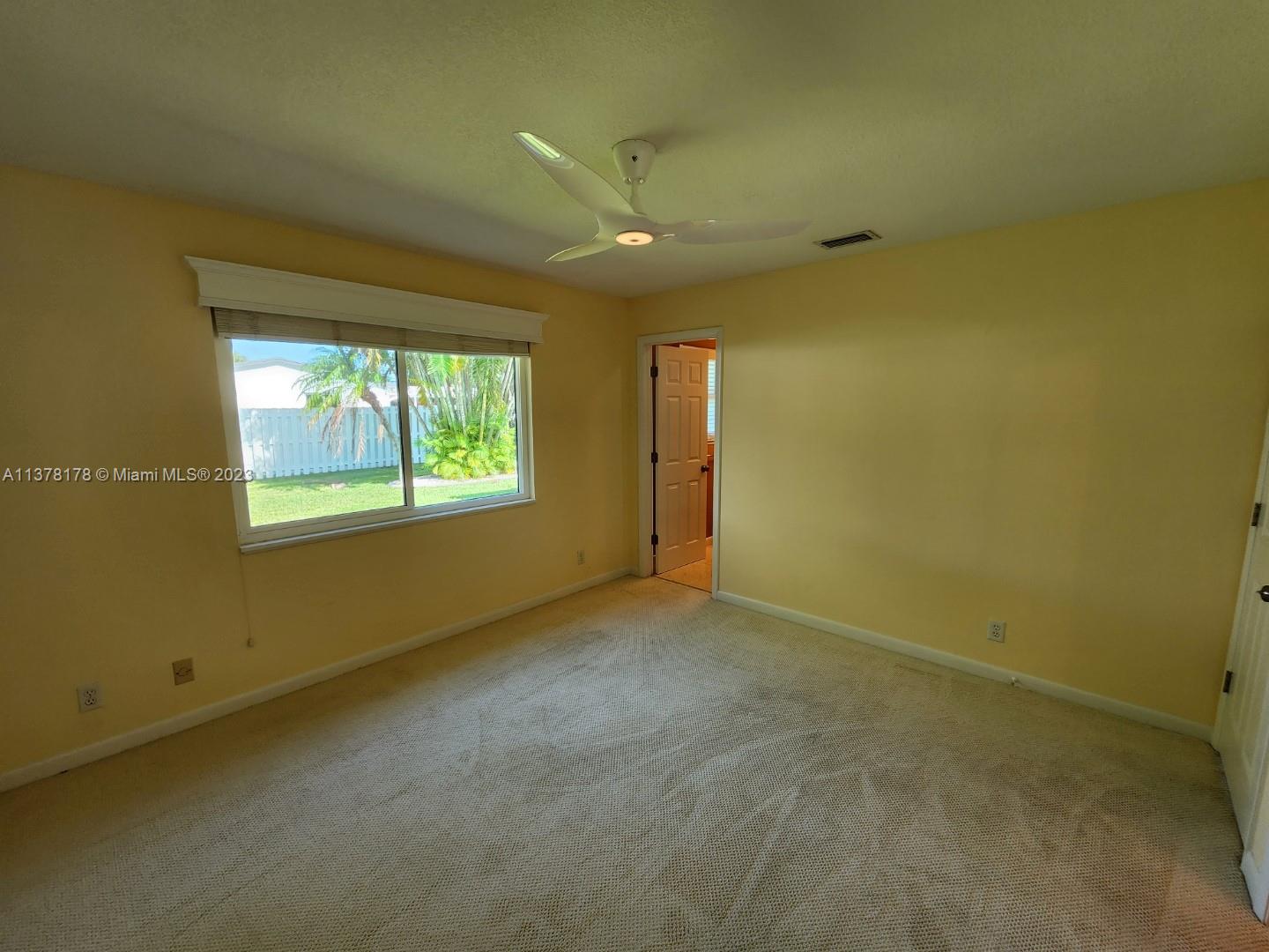 1513 Lance Road Jupiter, FL 33469 - Photo 24 of 33 a view of an empty room with a window