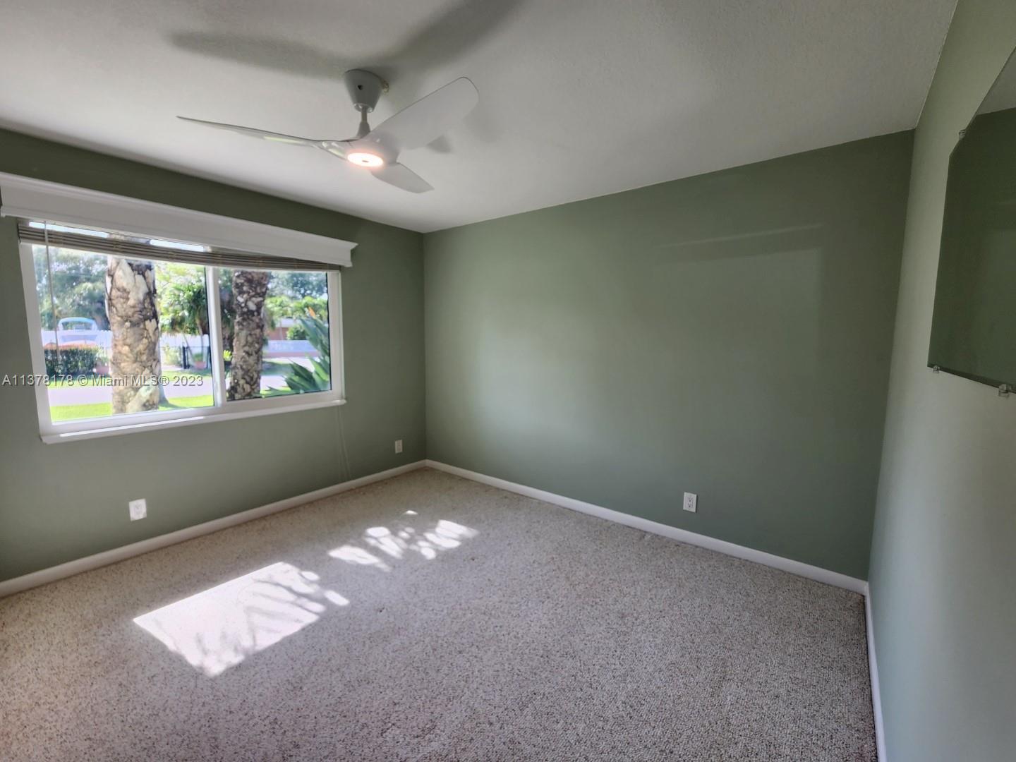 1513 Lance Road Jupiter, FL 33469 - Photo 27 of 33 an empty room with windows