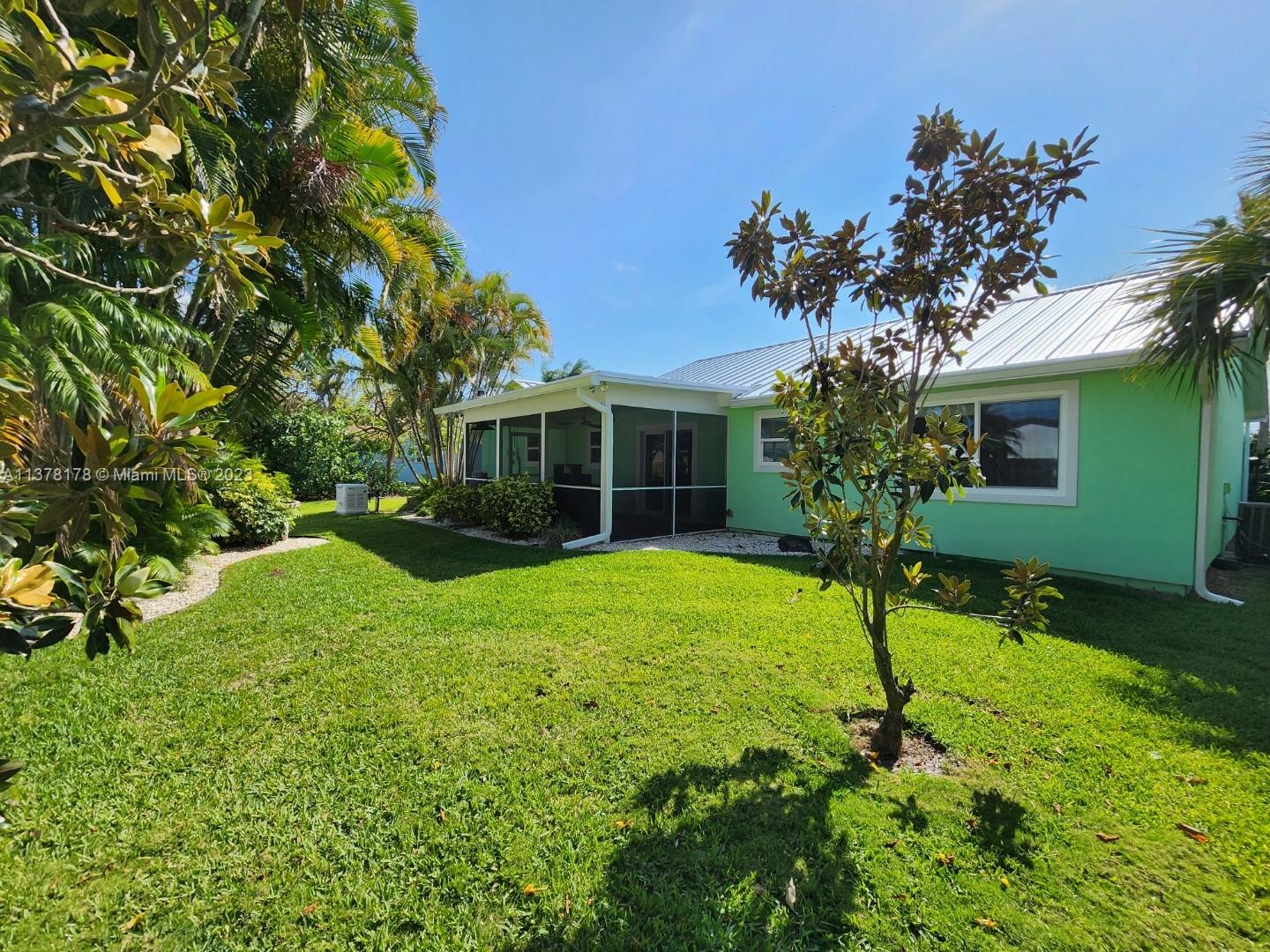 1513 Lance Road Jupiter, FL 33469 - Photo 4 of 33 a view of a house with a yard