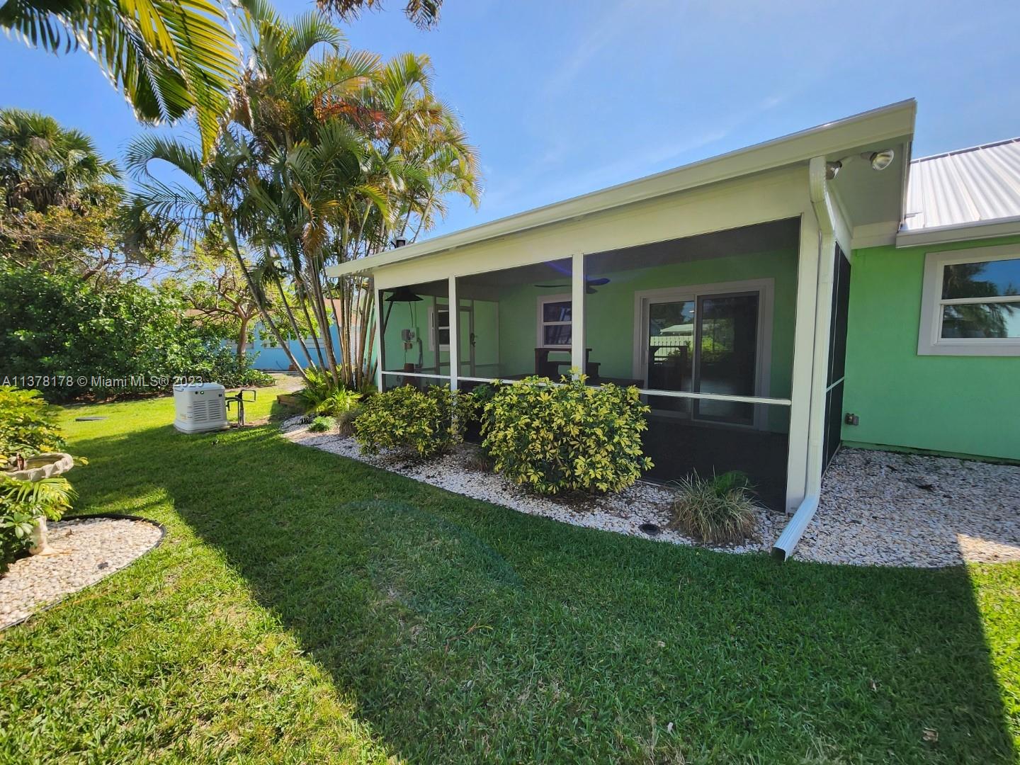 1513 Lance Road Jupiter, FL 33469 - Photo 5 of 33 a view of a house with a garden