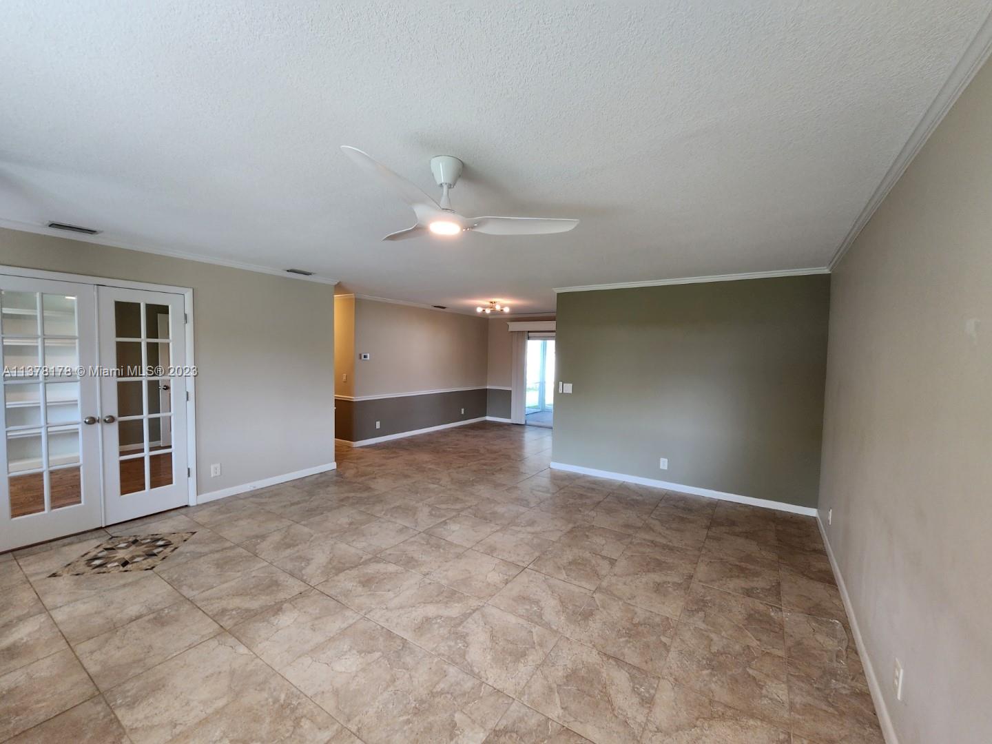 1513 Lance Road Jupiter, FL 33469 - Photo 7 of 33 a view of an empty room with a window