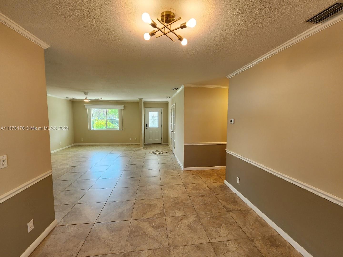 1513 Lance Road Jupiter, FL 33469 - Photo 8 of 33 a view of an empty room with a window