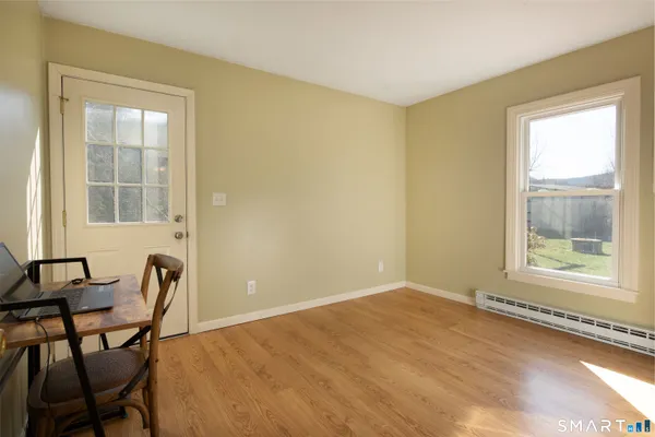 a view of room with furniture and windows