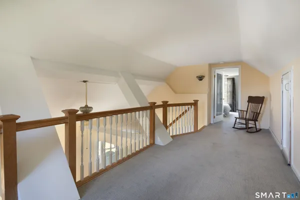 a view of a hallway with staircase