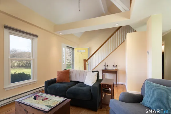 a living room with furniture and a window