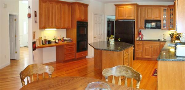 141 Stone School Road Sutton, MA 01590 - Photo 11 of 30 a kitchen with stainless steel appliances granite countertop a sink and a refrigerator