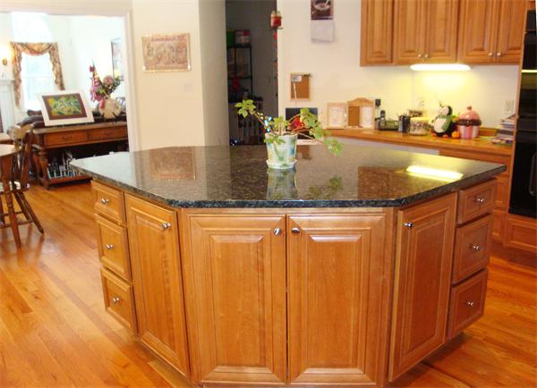 141 Stone School Road Sutton, MA 01590 - Photo 13 of 30 a kitchen with granite countertop a sink and cabinets