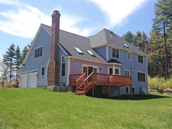141 Stone School Road Sutton, MA 01590 - Photo 2 of 30 a view of a house with a big yard and large trees