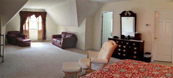 141 Stone School Road Sutton, MA 01590 - Photo 21 of 30 a bedroom with furniture and a large mirror