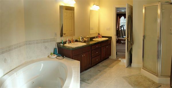 141 Stone School Road Sutton, MA 01590 - Photo 22 of 30 a spacious bathroom with a tub sink and mirror