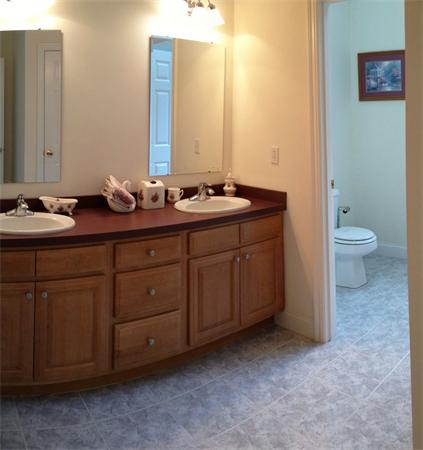 141 Stone School Road Sutton, MA 01590 - Photo 26 of 30 a bathroom with a double vanity sink and a mirror
