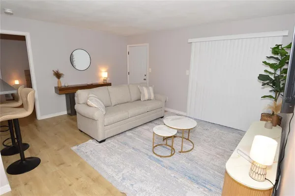 a bathroom with a sink a toilet and shower a mirror