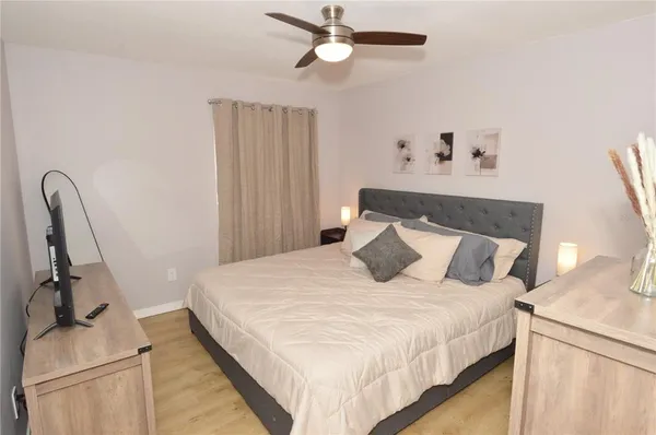 a view of a house with backyard porch and sitting area