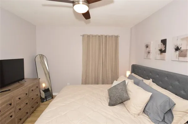 a view of a house with backyard porch and sitting area