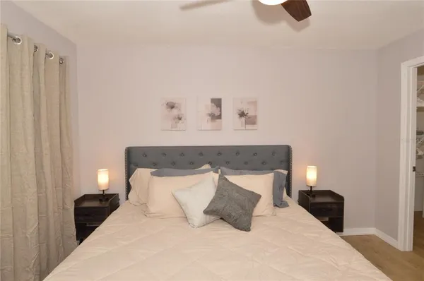 a view of a chair and table in the patio with wooden fence