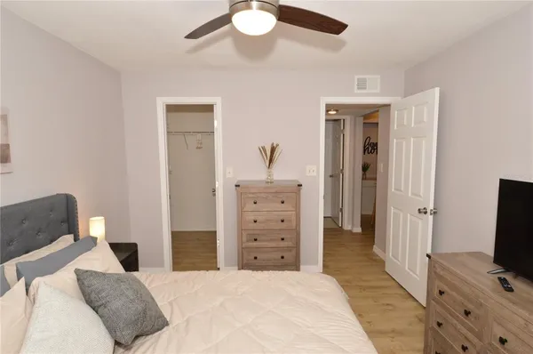 a front view of a house with swimming pool having outdoor seating