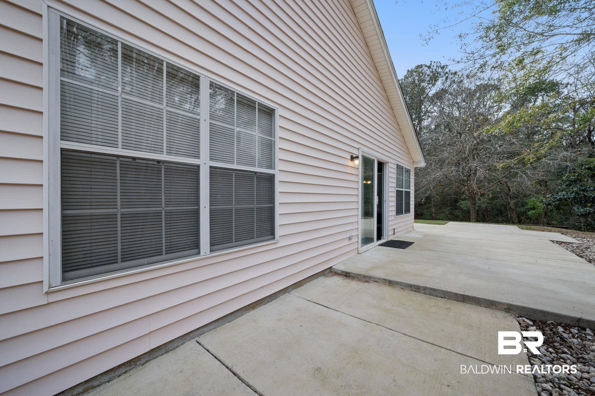 3716 Pepper Ridge Drive Mobile, AL 36693 - Photo 17 of 20 View of side of home with a patio